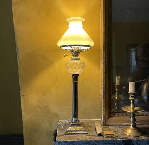 A set of four silver plate lamps by Hinks
