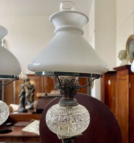 A set of four silver plate lamps by Hinks