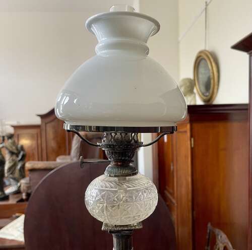 A set of four silver plate lamps by Hinks