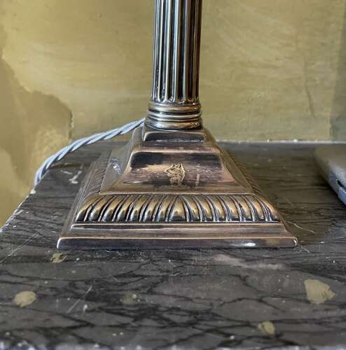 A set of four silver plate lamps by Hinks